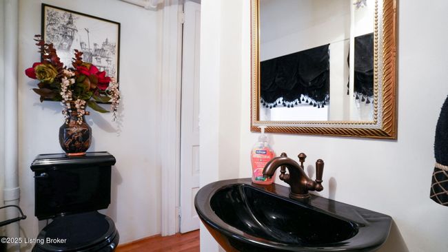 Lovely half bath under the front staircase. | Image 18