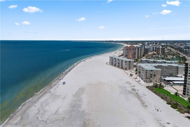 The soft sands glisten as the sun dips toward the horizon, creating a breathtaking, picture-perfect moment that truly takes your breath away. | Image 30