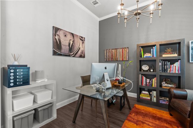 Office area featuring crown molding, wood finished floors, and a chandelier | Image 20