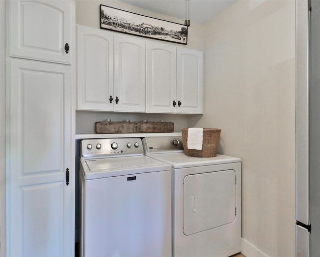 Laundry room with independent washer and dryer and cabinet space | Image 16
