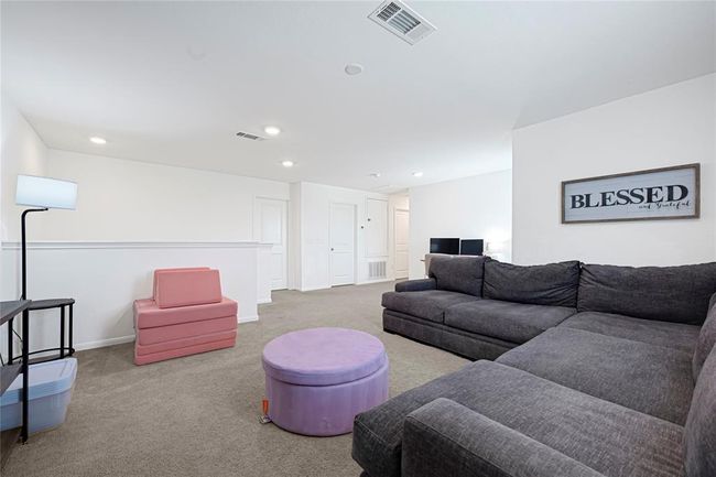Upstairs game room provides the perfect spot for entertainment or relaxation. | Image 17
