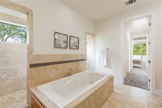 Full bath featuring a tub with jets and tile patterned flooring | Image 22