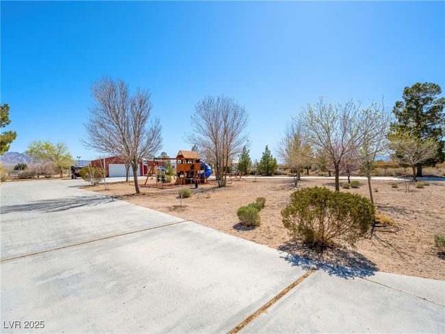 View of yard featuring playground community and driveway | Image 9