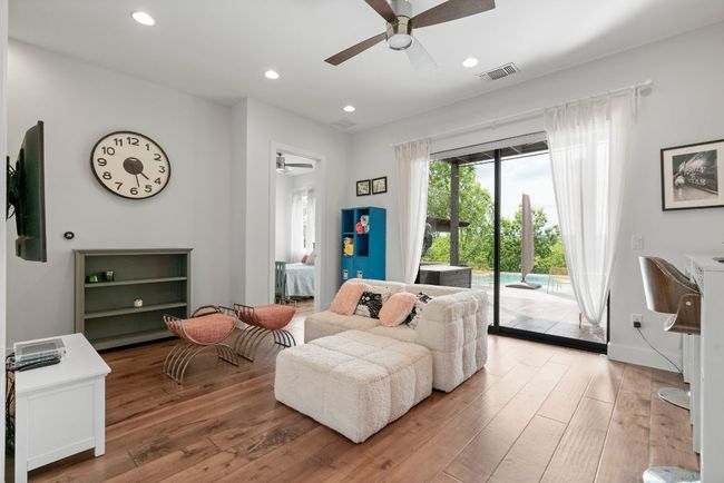Walk right out from the second living space to enjoy the pool. | Image 35