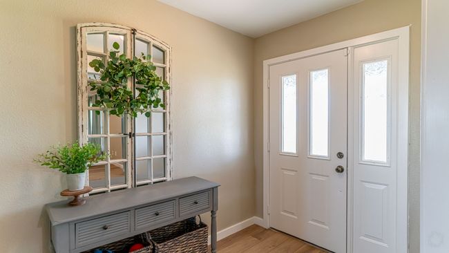 Foyer entrance with light wood-style flooring and baseboards | Image 5