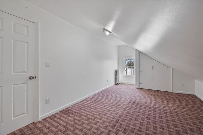 Bonus room featuring carpet flooring and lofted ceiling | Image 20