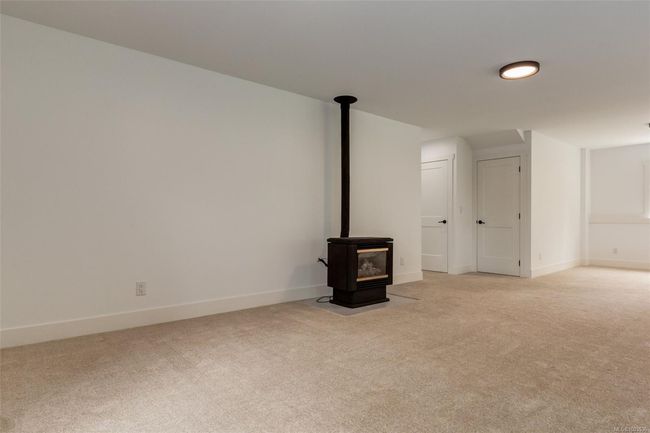 Bright rec room with fireplace | Image 72