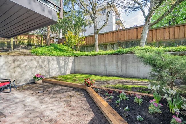 Fenced backyard featuring a deck | Image 16