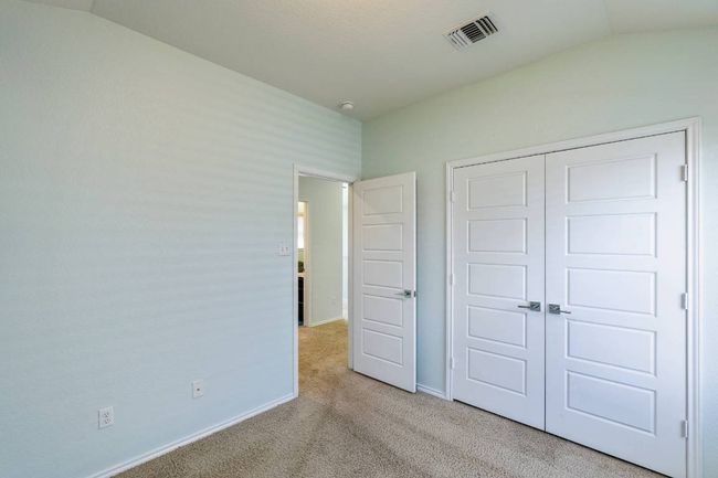 Unfurnished bedroom featuring carpet, lofted ceiling, and a closet | Image 30