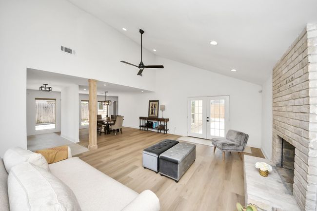 Living area with view of secondary courtyard & back door to the pool | Image 27