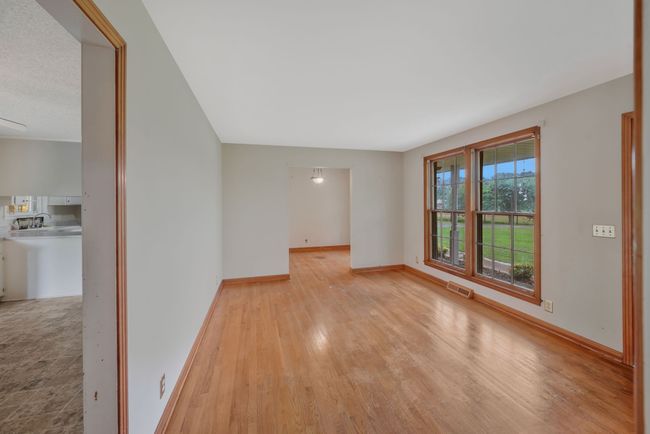 ANOTHER VIEW OF LIVING ROOM LOOKING INTO FORMAL DINING ROOM. | Image 15