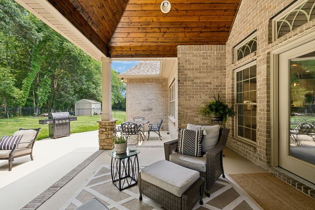 Freshly painted/sealed patio and porch floors all the way to the gate. | Image 50