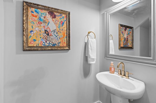 A half bath is conveniently located nearby for guests. | Image 11