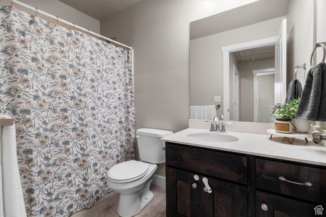 Full bath featuring vanity, toilet, and tile patterned floors | Image 25