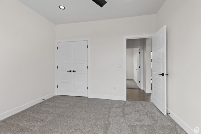 Unfurnished bedroom with baseboards, carpet floors, and recessed lighting | Image 28