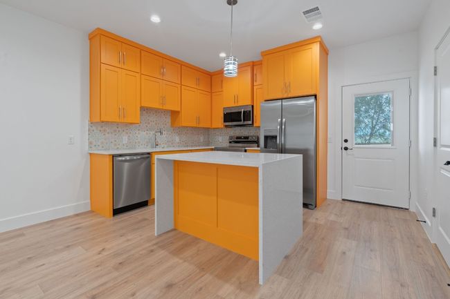 Decorative backsplash, and stainless appliances | Image 13