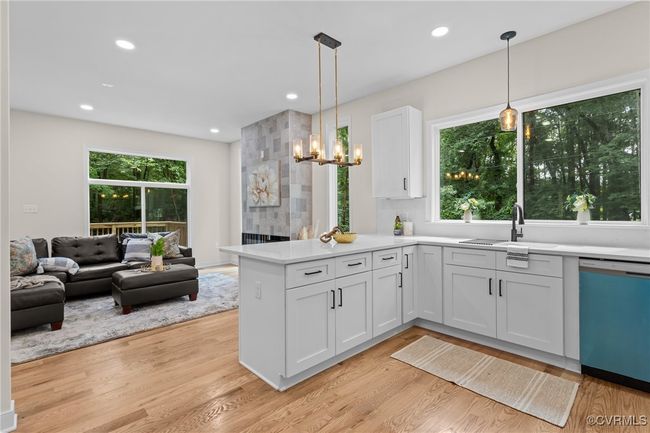 Kitchen with dishwasher, a peninsula, light wood-style floors, and recessed lighting | Image 13