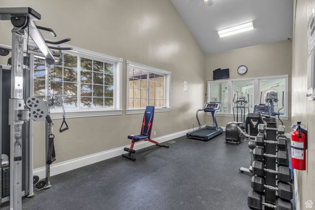 Gym featuring baseboards and high vaulted ceiling | Image 45