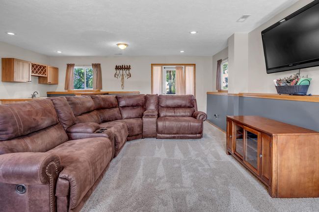 Living area featuring light colored carpet, recessed lighting, and baseboards | Image 22