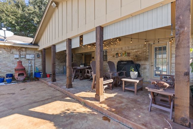 View of BACK patio / terrace with exterior fireplace | Image 34