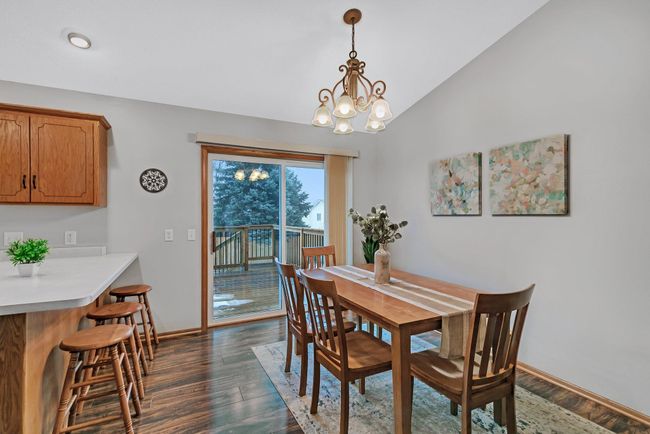 Sliding door off of dining to the refreshed deck with updated decking and spindles (2023) | Image 8