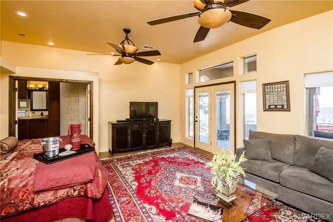 Living area with plenty of natural light, a ceiling fan, french doors, and recessed lighting | Image 69