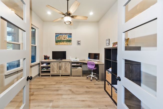 Home office featuring ceiling fan, french doors, recessed lighting, and light wood-style flooring | Image 15