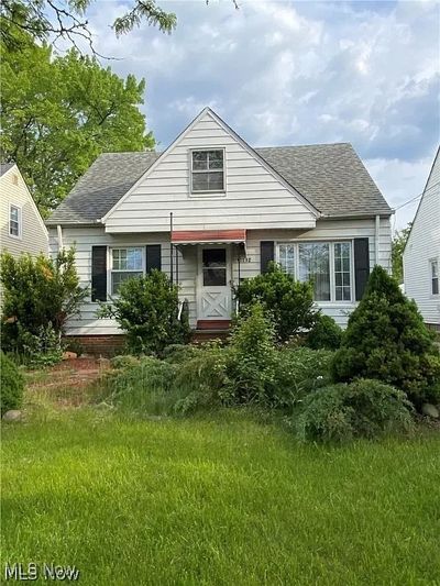 Back of property featuring a lawn | Image 1