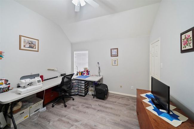 Another secondary bedroom being used as a craft room. There is a large closet to the right. | Image 22