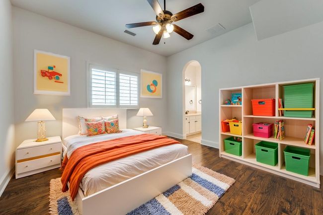 Bedroom with wood finished floors, visible vents, and baseboards | Image 11