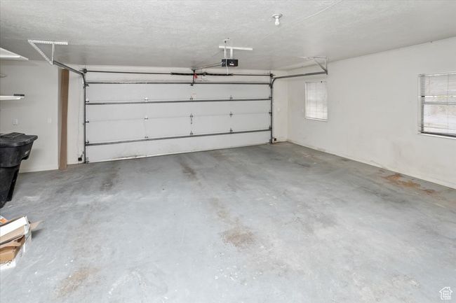 Garage with a garage door opener | Image 35