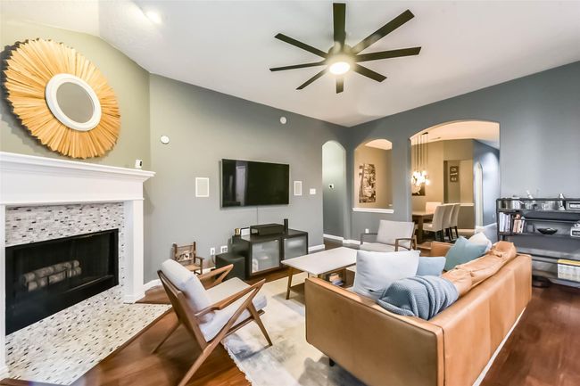 The kitchen opens up to the cozy living room. | Image 12
