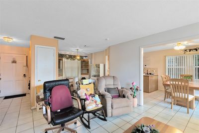 A lovely living room/dinette combo welcomes you inside. | Image 2