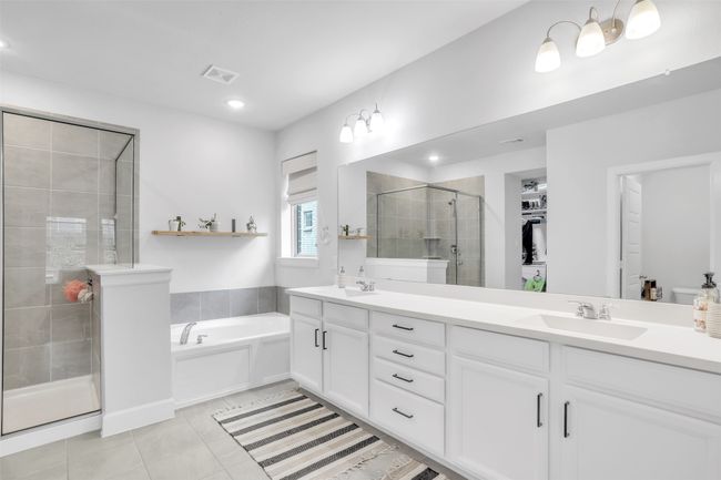 Bathroom featuring vanity, separate shower and tub, and tile patterned floors | Image 19