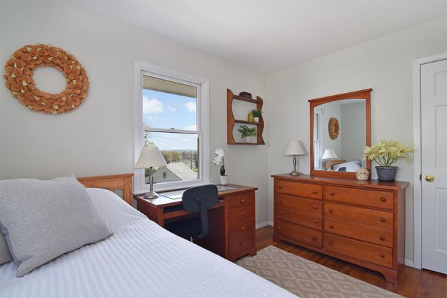 Bedroom featuring wood finished floors | Image 10