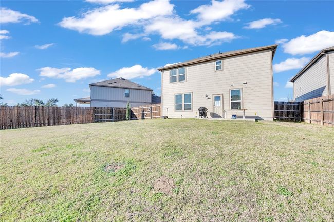 Rear view of house featuring a fenced backyard and a yard | Image 27