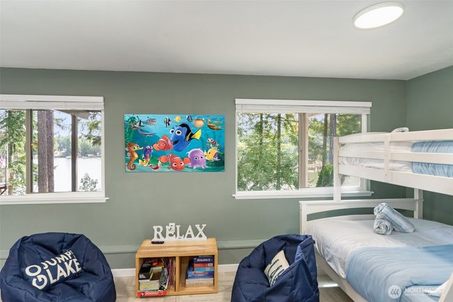 Bonus room downstairs with a wall of windows | Image 31