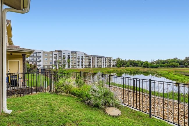 View of yard with view of pond | Image 26