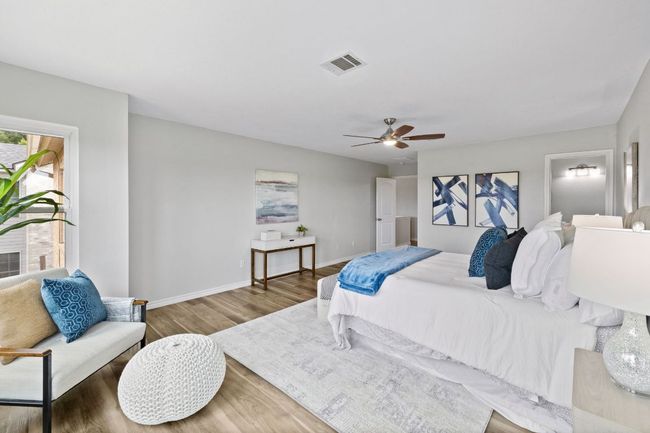 Bedroom featuring wood finished floors, baseboards, and ceiling fan | Image 31