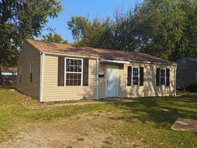 View of outdoor structure with a yard | Image 2