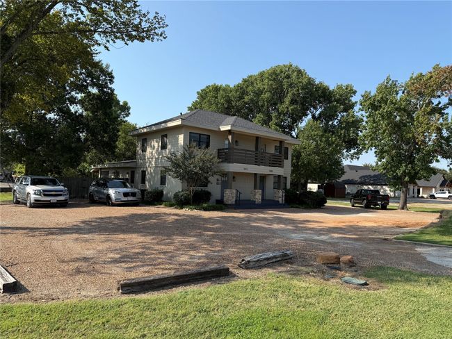 View of front of property with a balcony, covered porch, and driveway | Image 5