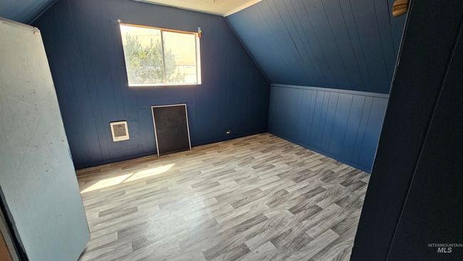 Additional living space with wood finished floors, vaulted ceiling, and wooden walls | Image 20