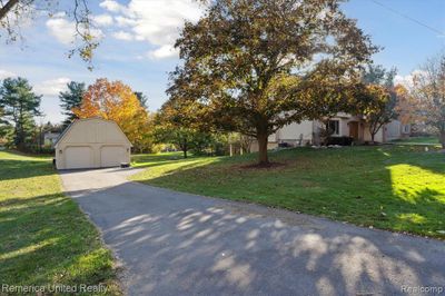 59031 Montego Drive, Home with 3 bedrooms, 3 bathrooms and null parking in Lyon Twp MI | Image 3