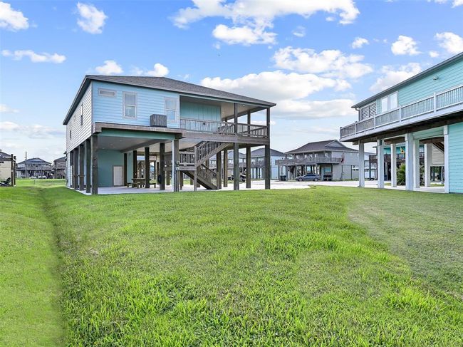 The ample side yard offers plenty of room for a fire pit, lawn games, or future outdoor enhancements. | Image 30