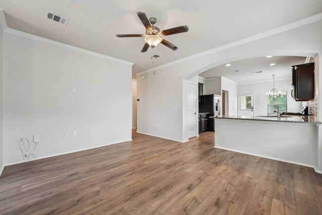 Featuring new floors and freshly painted walls. | Image 9
