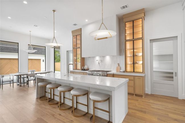 Intricately designed, this kitchen hosts all brand new Thermador appliances with thoughful details to make your culinary experiences a breeze. | Image 17