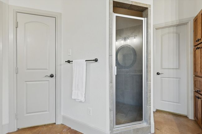 Full bathroom featuring a shower stall and tile patterned flooring | Image 20