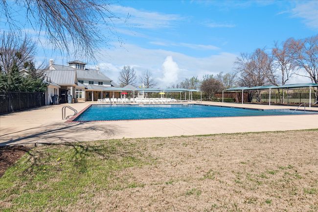 Pool featuring a patio area, a lawn, and fence | Image 31
