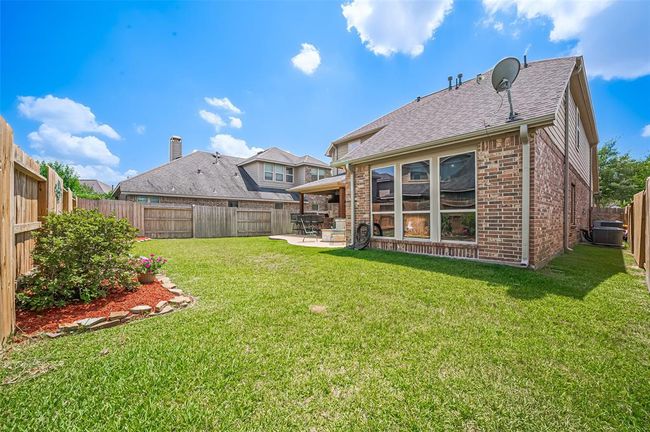 Enjoy low-maintenance living with a full-coverage sprinkler system and gutters that support proper drainage and exterior care. | Image 45