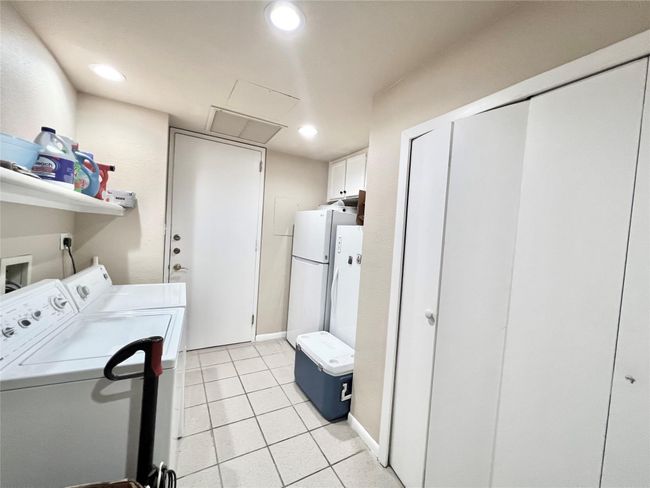 Butlers pantry, utility room, backdoor to the property, storage, washer/dryer | Image 14